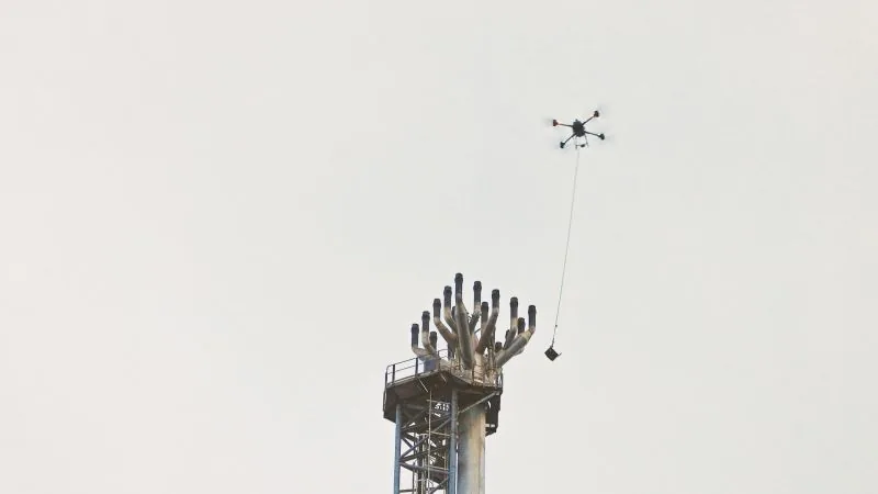 Drone cargo lift removing falling object from a live flare tip — no personnel at height, no shutdown